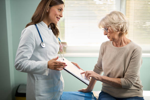 istock Mature woman visiting a doctor. 2191054824