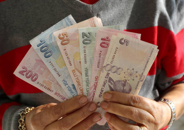 istock Woman Hands holding Turkish Lira Banknotes 2191054884