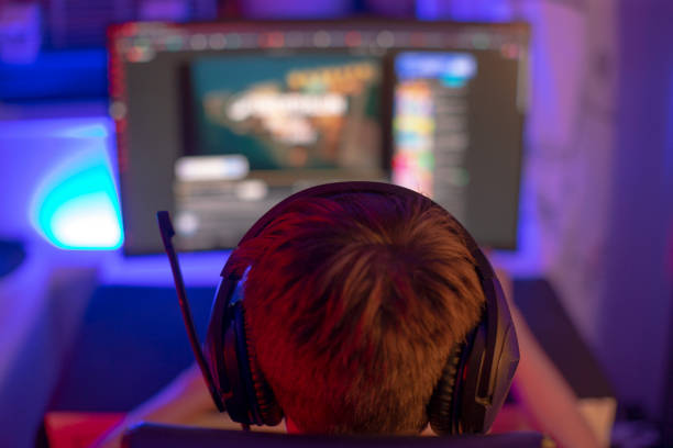 istock A boy with headphones plays a video game on a computer 2191054902