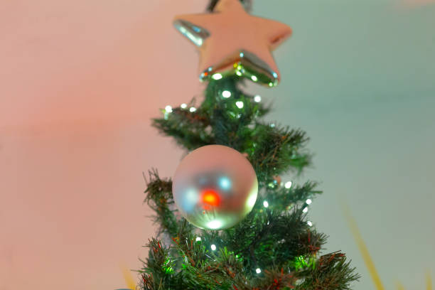 istock A beautifully decorated Christmas tree featuring a star on its top 2191055506