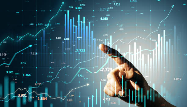 istock Hand pointing at financial graphs on digital screen displaying stock market trends and data analysis with upward growth charts. 2191058550