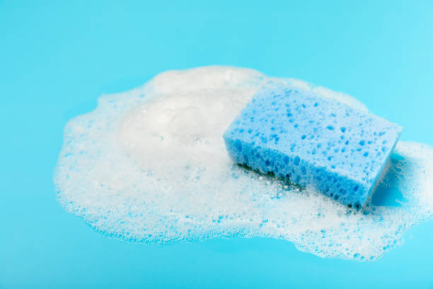 istock Colorful dish sponges on textured background. Kitchen sponge. Cleaning concept, cleaning service. Dishwashing liquid with clean and dirty dishes plate. Place for text, copy space. Wash the dishes. 2191060980