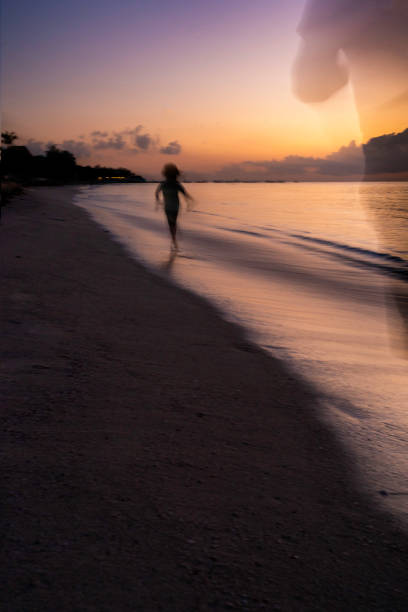 Silhouette of a person being chased on the ocean coast, Holbox Isle, Mexico