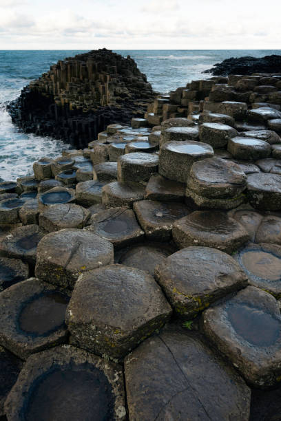 Giant's Causeway in Northern Ireland, made up of over 40,000 interlocking basalt columns formed by volcanic activity around 60 million years ago, Ireland,