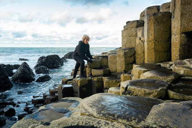 Giant's Causeway in Northern Ireland, made up of over 40,000 interlocking basalt columns formed by volcanic activity around 60 million years ago, Ireland,
