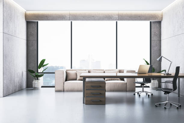 istock Modern executive office interior with desk, chair, sofa, and city view through large window. Clean and minimalist design. 3D Rendering 2191062222