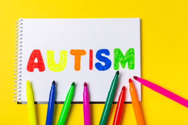 istock Autism awareness day.2 April world autism awareness day background.Design element.Care Awareness campaign for Autism.AUTISM text with colorful wooden puzzles, letters and cubes.Space for text.Top view 2191062533