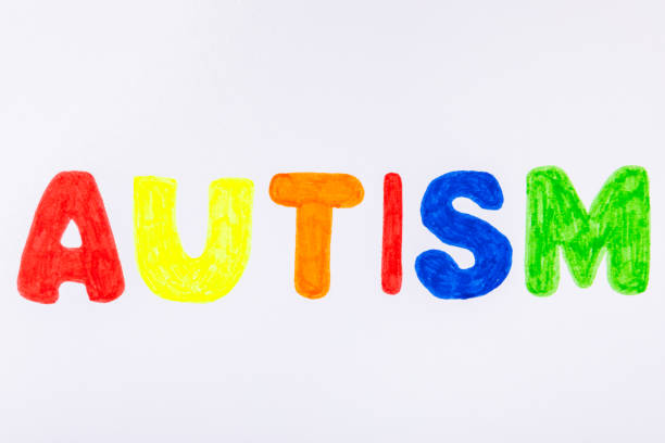 istock Autism awareness day.2 April world autism awareness day background.Design element.Care Awareness campaign for Autism.AUTISM text with colorful wooden puzzles, letters and cubes.Space for text.Top view 2191062541