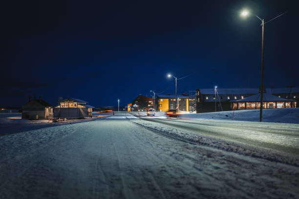istock Winter Night in Longyearbyen: Snowy Landscape with Lights 2191065059