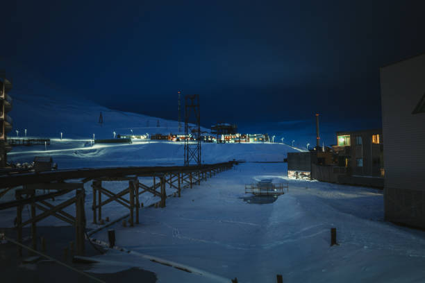istock Arctic Waterfront at Night: Snow and Pipe Structures in Longyearbyen, Svalbard 2191065754