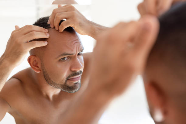 istock Male checking out his hair 2191067727