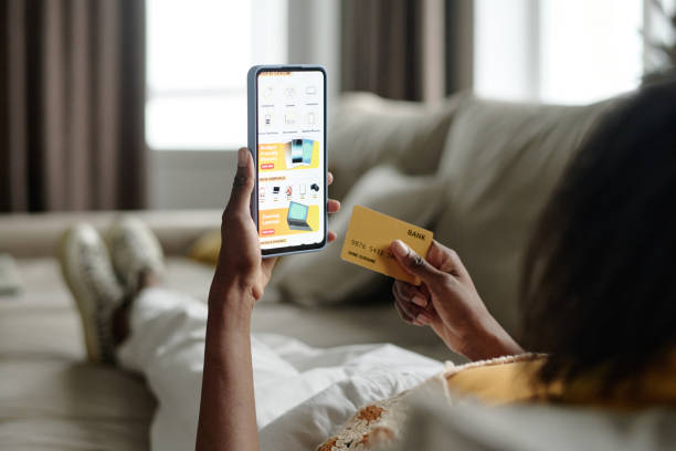 istock Unrecognizable Woman Enjoying Online Shopping on Sofa 2191067792