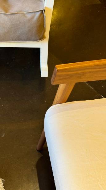 istock Armchairs, beige and brown, on a dark floor 2191071699