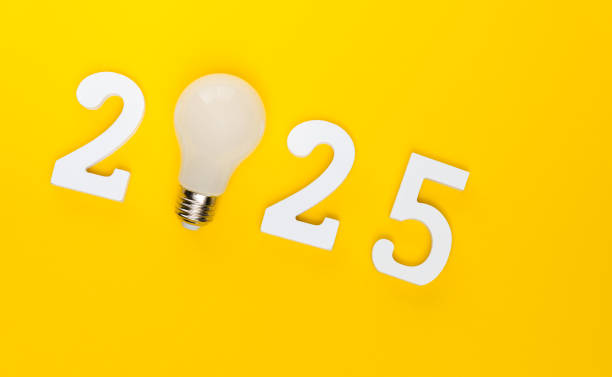istock New year 2025 text with light bulb on orange background 2191072325