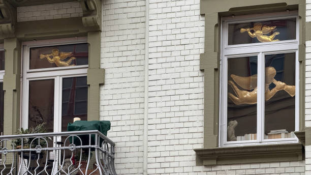 Christmas angel flying in a window