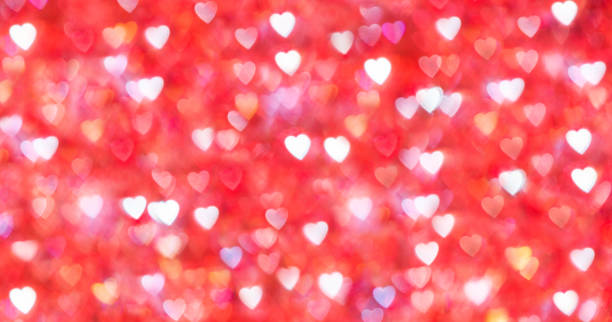 istock Defocused red background with heart shaped bokeh for Valentine's Day 2191072384