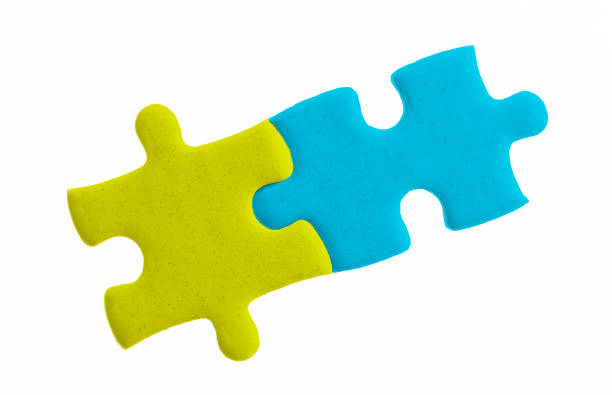Two white puzzle pieces comes together on blue background