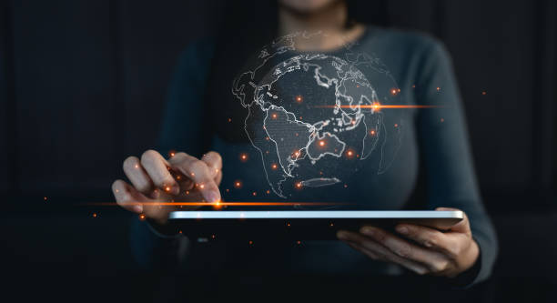 Big data analytics and business intelligence concept. Businessman holding Global network connection. World map point and line composition concept of global business.Digital link tech.