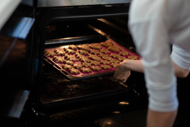 istock Placing freshly cut cookies in the oven 2191081850