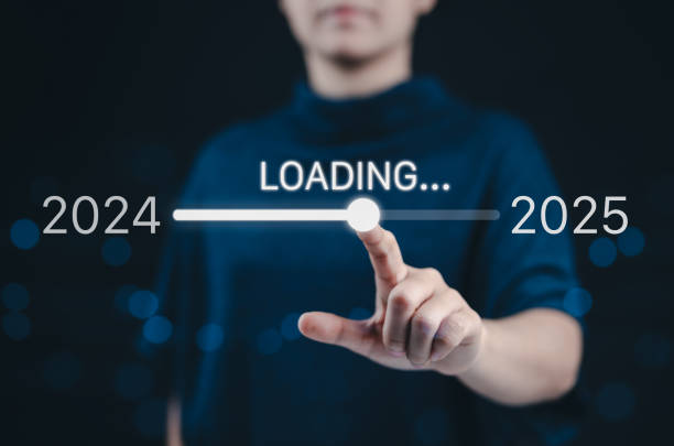 Progress and transition from 2024 to 2025 concept. A woman pointing to loading bar transitioning from 2024 to 2025, progress, future planning, and new year goals. annual planning and business growth.