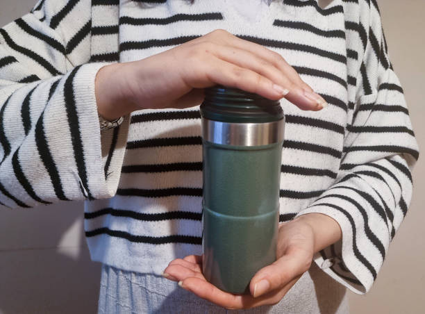 istock Woman's hands holding reusable insulated water bottle 2191085144