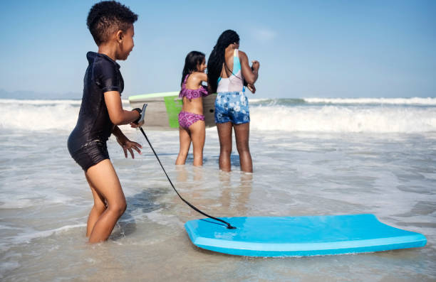 Single mother and young son enjoy time at the beach