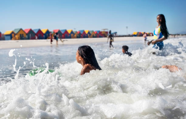 istock Children enjoying bodyboarding at beach in summer 2191086653