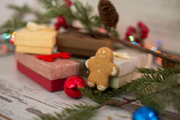 Brown Christmas gift box with a blank tag on rustic wooden table