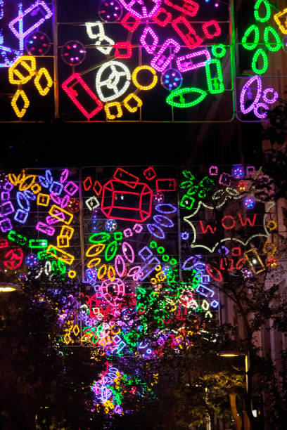 Street multicolored light Christmas decorations, city street, downtown district, . Madrid, Spain.