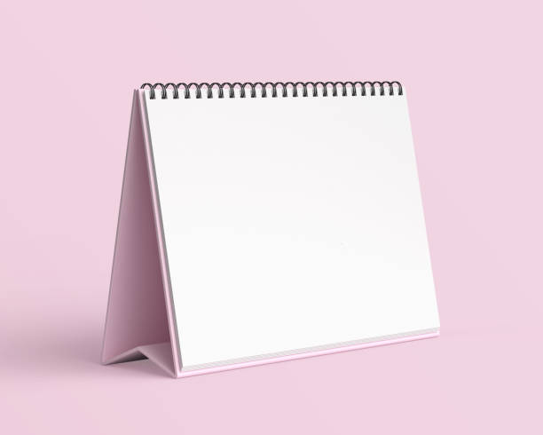 istock Empty desk calendar mockup on light pink background. 2191091144