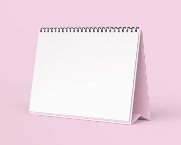 istock Empty desk calendar mockup on light pink background. 2191091998