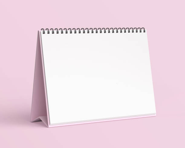istock Empty desk calendar mockup on light pink background. 2191092220