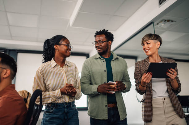 istock Business people walking and talking in modern office 2191092707