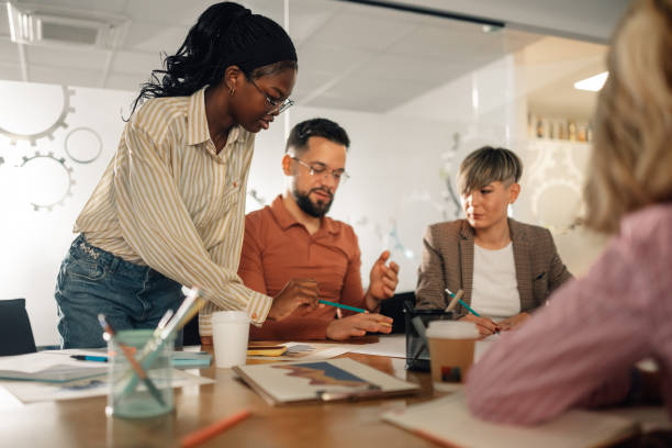 istock Marketing team analyzing graphs and discussing new project during a meeting 2191092722