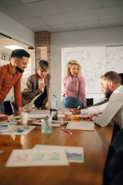 istock Marketing professionals collaborating on project in modern office 2191092727