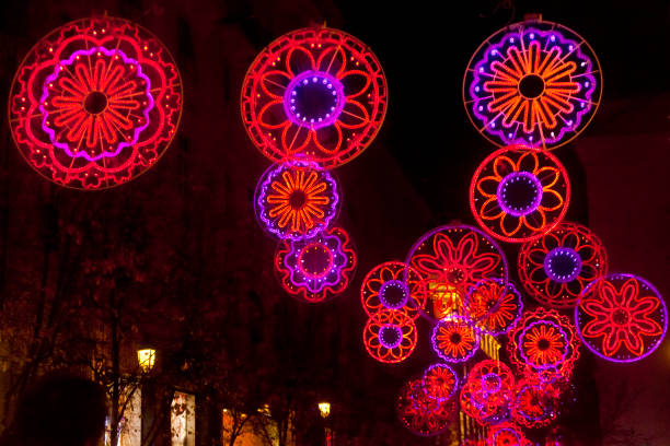 Street multicolored light Christmas decorations, avenue tinsel, downtown district, . Madrid, Spain.