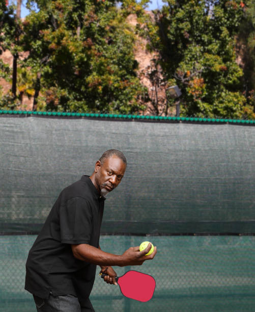 istock Pickleball African American Man Red Paddle 2191095123