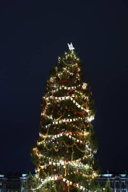 istock A brightly illuminated Christmas tree at night, showcasing its splendor and charm 2191097400