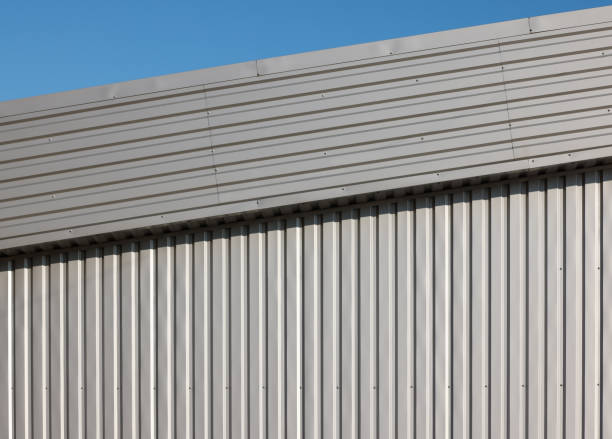 istock Corrugated metal facade reflecting sunlight on a clear day 2191097767