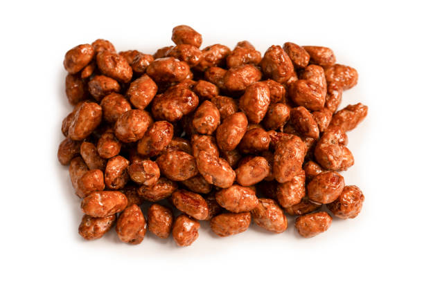 istock Tasty sweet roasted peanuts isolated on a white background. 2191098166