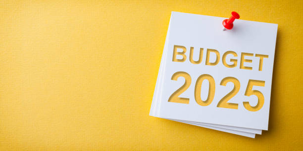 istock Budget 2025 Word in White Sticky Note on Yellow Chardboard Background 2191100852