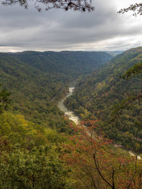 istock New River Gorge National Park in West Virginia transforms as early fall colors mix with dramatic clouds, creating a stunning seasonal scene. 2191102109