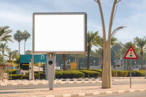 istock Large blank white billboard on roadside pavement in city center 2191103934