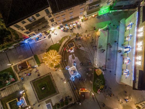 istock Festive city square illuminated at night. 2191104272