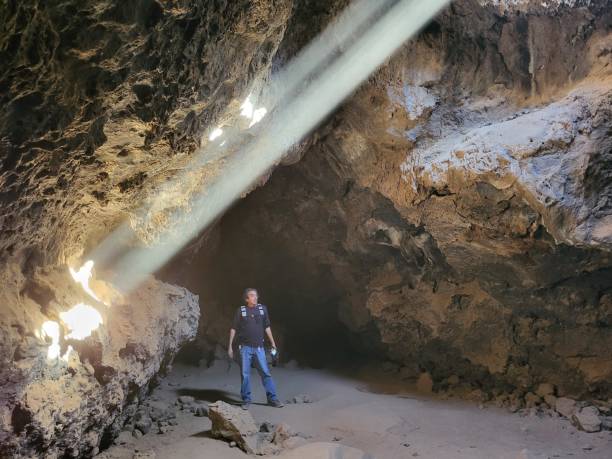 istock A Man Standing Inside The Cave of Lava Tube 2191105997
