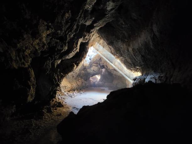 istock Double Sunbeam illuminate Mojave Lava Tube Cave 2191106005