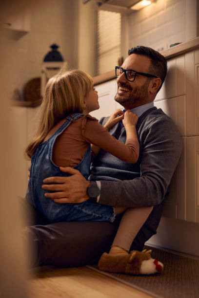 istock Happy man talking to his small daughter at home. 2191106338