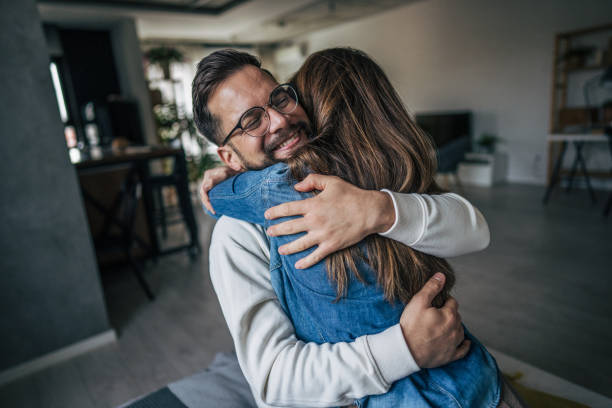 istock couple embracing at home 2191108789