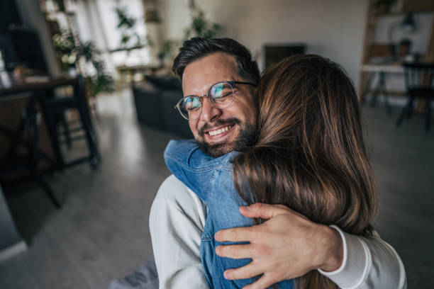 istock couple embracing at home 2191108808