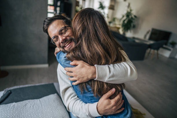 istock couple embracing at home 2191108818